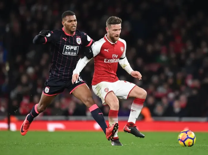 Framed Print : Mustafi vs Mounie: A Premier League Battle at Emirates Stadium