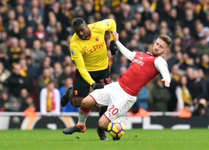 Framed Print : Mustafi vs. Okaka: Intense Clash between Arsenal's Defense and Watford's Forward in the Premier League