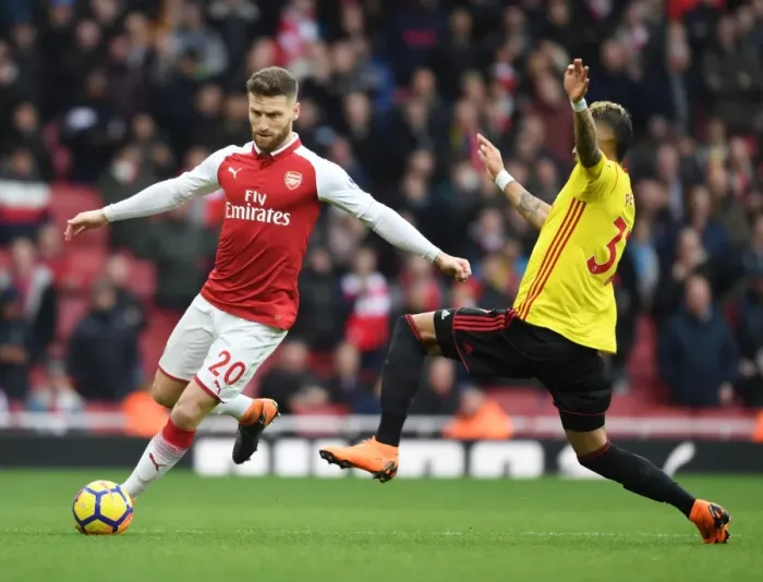 Framed Print : Mustafi vs. Pereyra: Intense Clash Between Arsenal and Watford Players