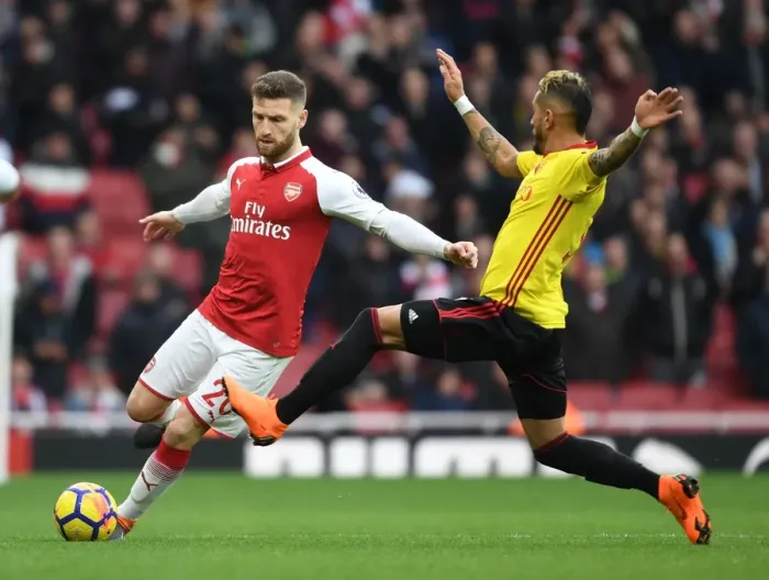 Framed Print : Mustafi vs Pereyra: Intense Clash Between Arsenal and Watford Players