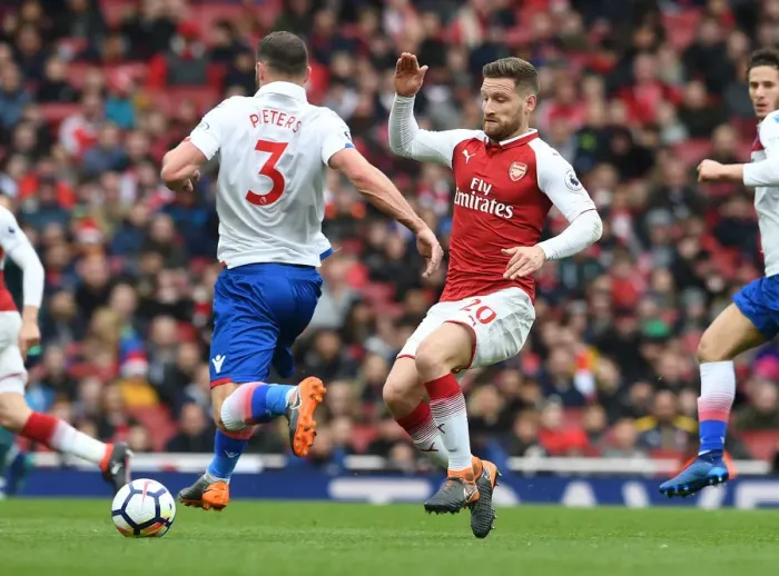 Framed Print : Mustafi vs Pieters: Intense Clash in Arsenal v Stoke City Premier League Match
