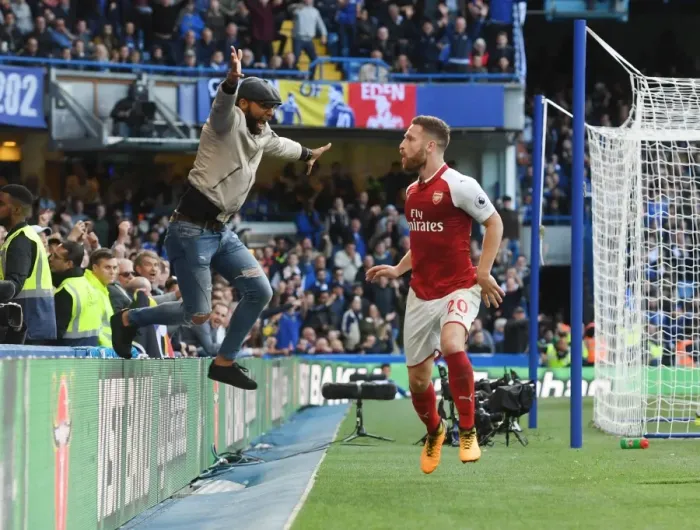Framed Print : Mustafi's Disallowed Goal: Ardent Arsenal Fan Invades Pitch in Chelsea Clash (2017-18) Framed Print : Mustafi's Disallowed Goal: Ardent Arsenal Fan Invades Pitch in Chelsea Clash (2017-18)