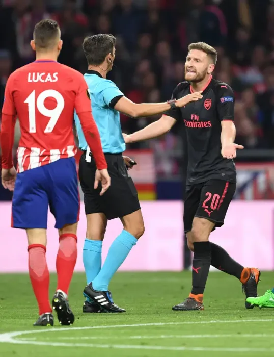 Framed Print : Mustafi's Dispute with Referee Rocchi in Arsenal's UEFA Europa League Semi-Final Clash against Atletico Madrid Framed Print : Mustafi's Dispute with Referee Rocchi in Arsenal's UEFA Europa League Semi-Final Clash against Atletico Madrid