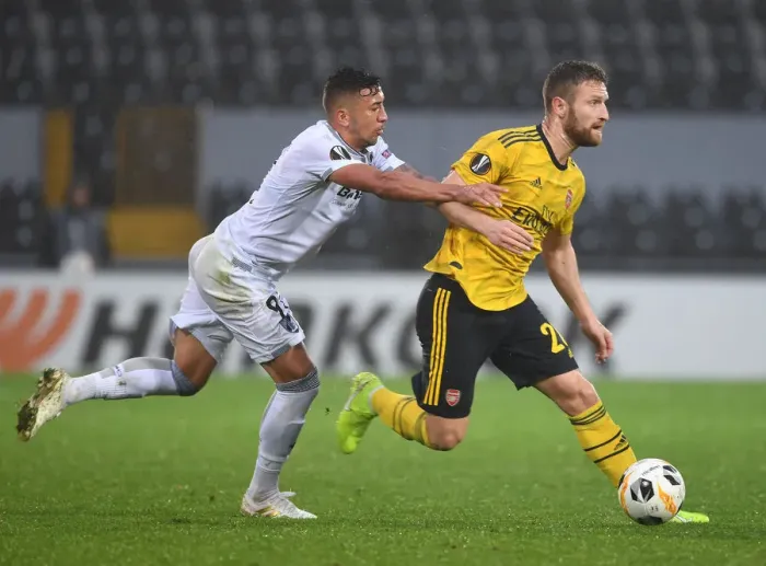 Framed Print : Mustafi's Powerful Run: Arsenal Overpowers Vitoria's Defense in Europa League Victory