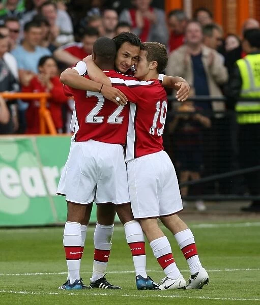 Nacer Barazite celebrates scoring the 2nd Arsenal goal with Jack Wilshere and Jay Simpson