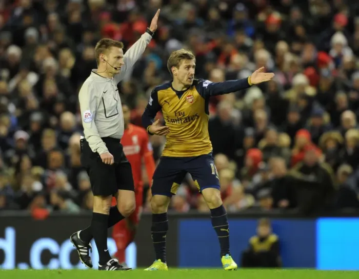 Framed Print : Nacho Monreal Argues with Referee during Intense Liverpool vs. Arsenal Premier League Clash (2015-16) Framed Print : Nacho Monreal Argues with Referee during Intense Liverpool vs. Arsenal Premier League Clash (2015-16)