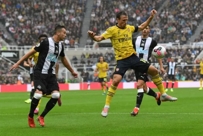 Framed Print : Nacho Monreal Faces Pressure from Javier Manquillo in Newcastle United vs Arsenal FC Premier League Clash Framed Print : Nacho Monreal Faces Pressure from Javier Manquillo in Newcastle United vs Arsenal FC Premier League Clash