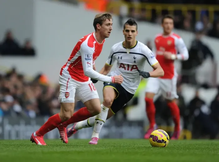 Framed Print : Nacho Monreal Outmaneuvers Erik Lamela: A Battle in the Premier League Clash Between Tottenham and Arsenal