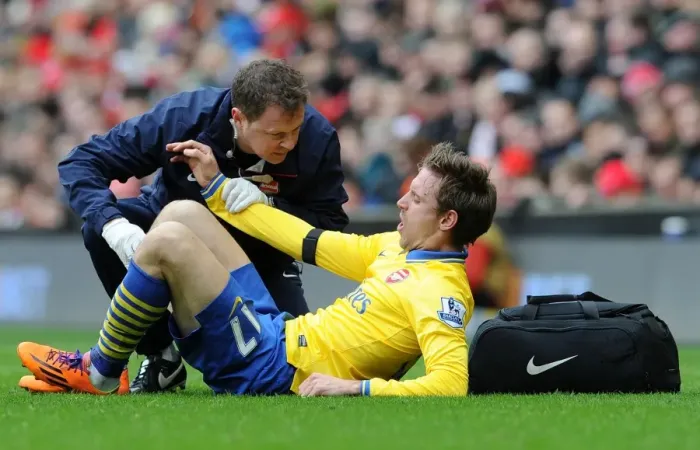 Framed Print : Nacho Monreal Receives Treatment from Arsenal Physio during Liverpool vs Arsenal Match (2014) Framed Print : Nacho Monreal Receives Treatment from Arsenal Physio during Liverpool vs Arsenal Match (2014)