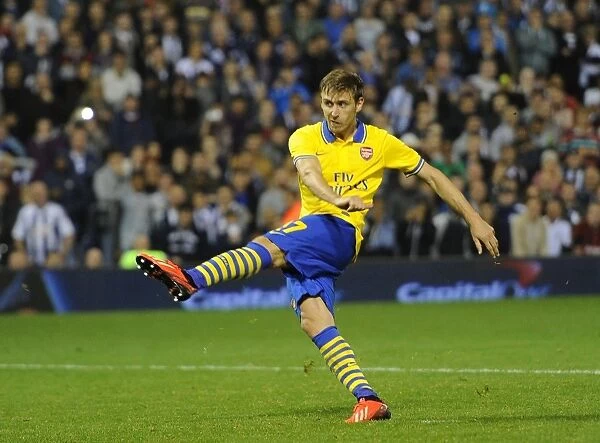 Nacho Monreal Scores the Winning Penalty: Arsenal Advance in Capital One Cup vs West Bromwich Albion