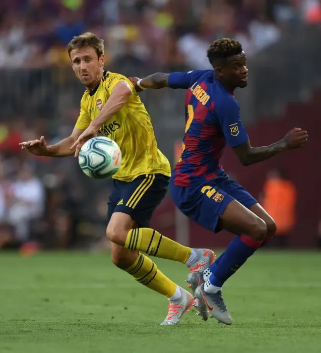 Framed Print : Nacho Monreal vs Semedo: A Clash of Titans in FC Barcelona vs Arsenal Pre-Season Friendly (2019)