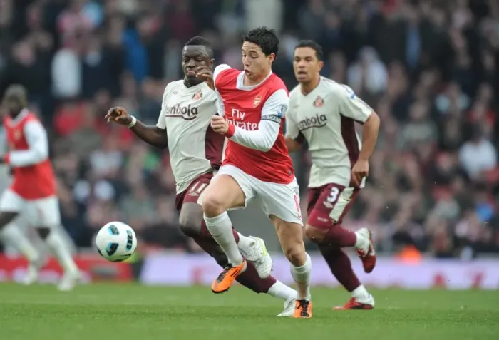 Framed Print : Nasri vs Muntari: A Battle of Midfielders Ends in a Draw at Emirates