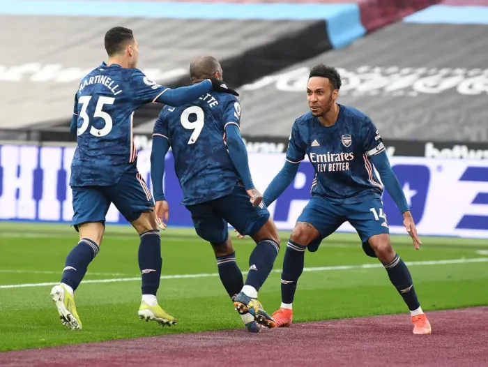 Framed Print : Empty Net Triumph: Lacazette, Martinelli, Aubameyang's Goal Celebration at London Stadium
