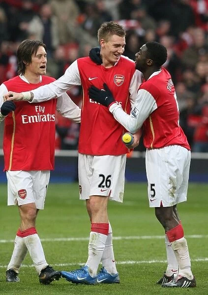 Nicklas Bendtner, Kolo Toure and Tomas Rosicky celebrate the Arsenal victory