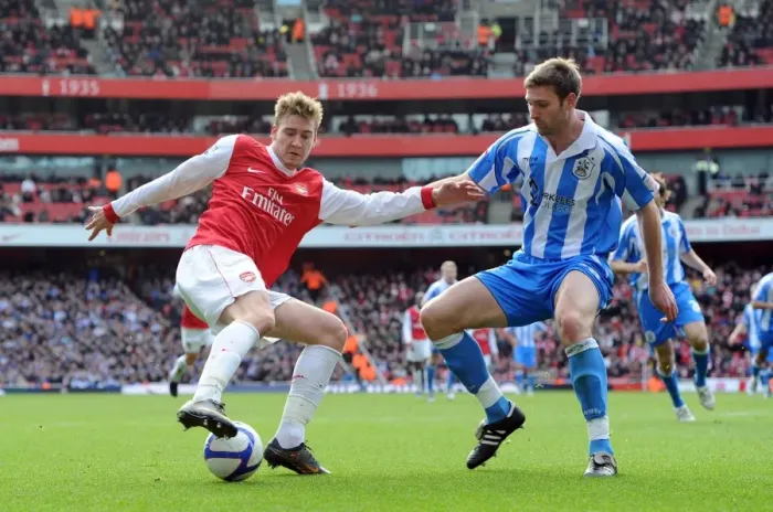 Framed Print : Nicklas Bendtner (Arsenal) Jamie McCombe (Huddersfield). Arsenal 2: 1 Huddersfield Town Framed Print : Nicklas Bendtner (Arsenal) Jamie McCombe (Huddersfield). Arsenal 2: 1 Huddersfield Town