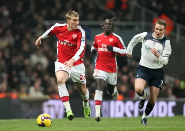 Framed Print : Nicklas Bendtner (Arsenal) Matt Taylor (Bolton) Framed Print : Nicklas Bendtner (Arsenal) Matt Taylor (Bolton)