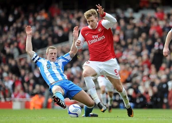 Nicklas Bendtner (Arsenal) Peter Clarke (Huddersfield). Arsenal 2: 1 Huddersfield Town