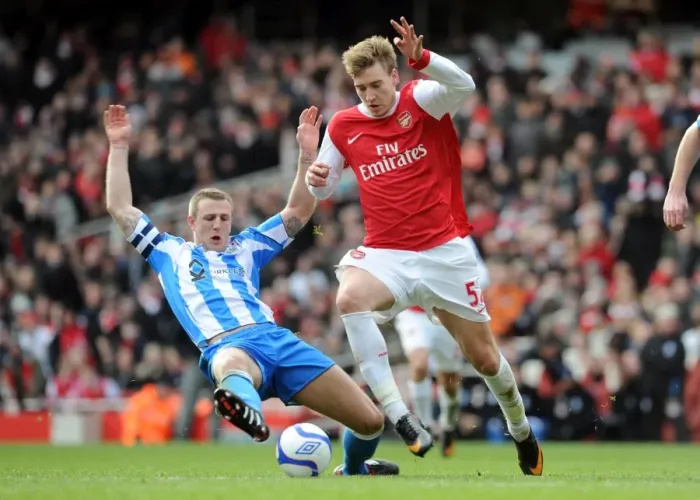Framed Print : Nicklas Bendtner (Arsenal) Peter Clarke (Huddersfield). Arsenal 2: 1 Huddersfield Town