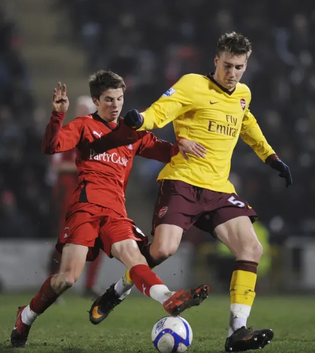 Framed Print : Nicklas Bendtner (Arsenal) Tommy Carroll (Orient). Leyton Orient 1: 1 Arsenal