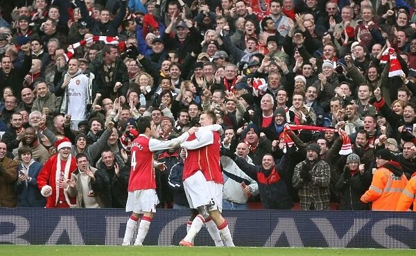 Nicklas Bendtner celebrates scoring the 2nd Arsenal goal with Cesc Fabregas