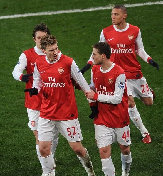Nicklas Bendtner celebrates scoring the 3rd Arsenal goal with Conor Henderson