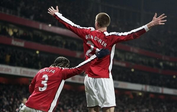 Nicklas Bendtner celebrates scoring Arsenals goal with Bacary Sagna
