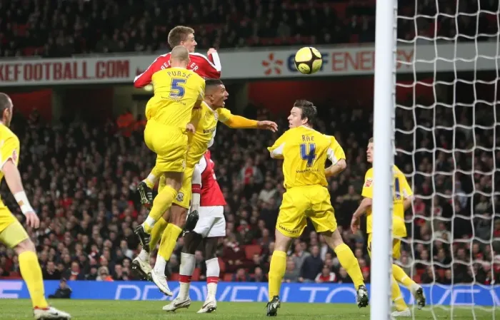 Framed Print : Nicklas Bendtner heads past Cardiff goalkeeper Tom Framed Print : Nicklas Bendtner heads past Cardiff goalkeeper Tom
