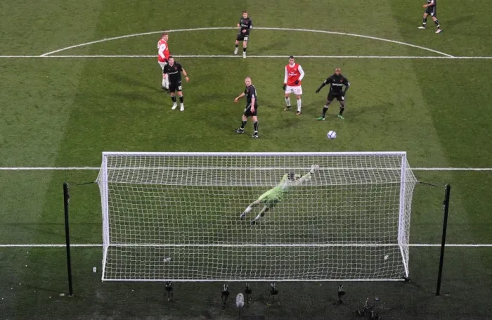Framed Print : Nicklas Bendtner heads past Orient goalkeeper Jamie Jones to score the 2nd Arsenal goal