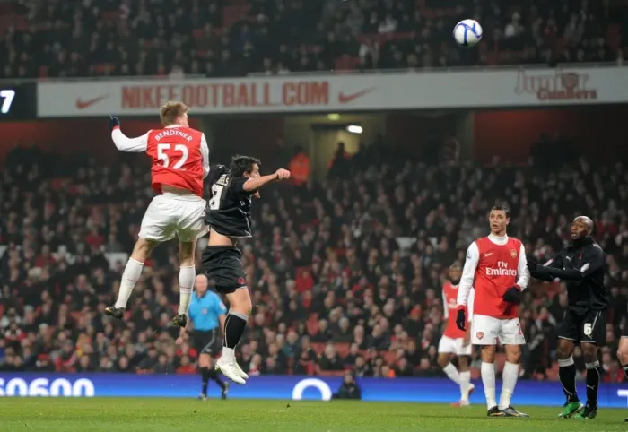 Framed Print : Nicklas Bendtner scores his 1st goal, Arsenals 2nd, under pressure from Charlie Daniels