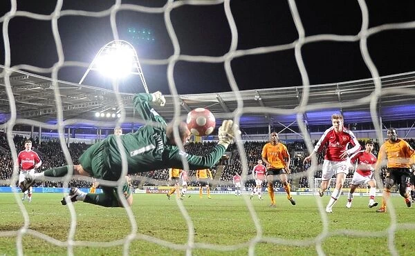 Nicklas Bendtner shoots past Hull goalkeeper Boaz Myhill to score the 2nd Arsenal goal
