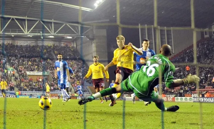 Framed Print : Nicklas Bendtner shoots past Wigan goalkeeper Ali Al Habsi to score the 2nd Arsenal goal Framed Print : Nicklas Bendtner shoots past Wigan goalkeeper Ali Al Habsi to score the 2nd Arsenal goal