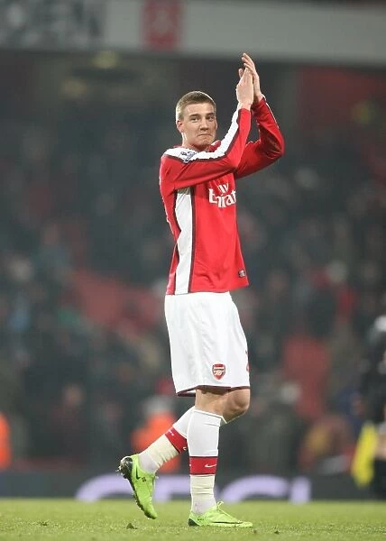 Nicklas Bendtner waves to the Arsenal fans after the match