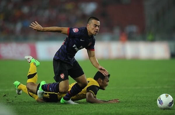 Nico Yennaris vs Mohd Sali: Clash of Talents in Arsenal's 2012-13 Pre-Season Match against Malaysia XI