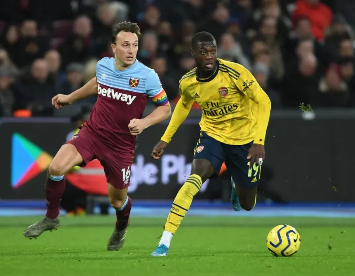 Framed Print : Nicolas Pepe Breaks Past Noble: West Ham vs Arsenal, Premier League 2019-20