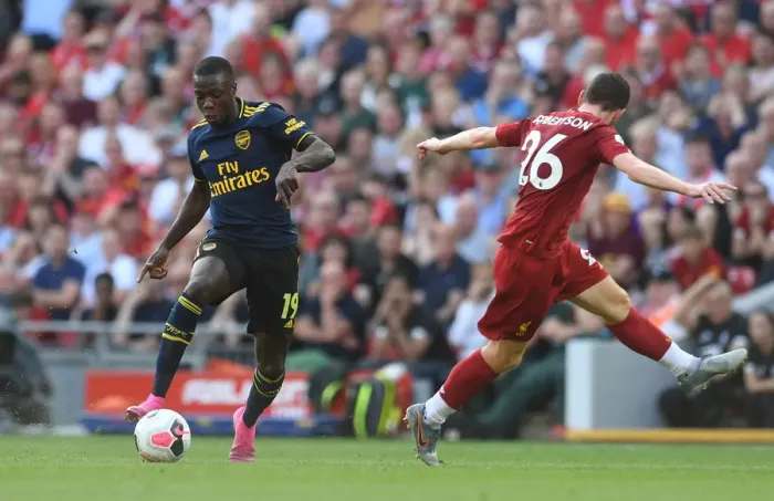Framed Print : Nicolas Pepe Evades Andy Robertson: Liverpool vs. Arsenal, Premier League 2019-20