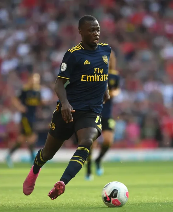 Framed Print : Nicolas Pepe Faces Off Against Liverpool: Arsenal vs. Liverpool, Premier League 2019-20