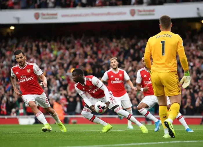 Framed Print : Nicolas Pepe gabs the ball after scoring Arsenals 1st goal Framed Print : Nicolas Pepe gabs the ball after scoring Arsenals 1st goal