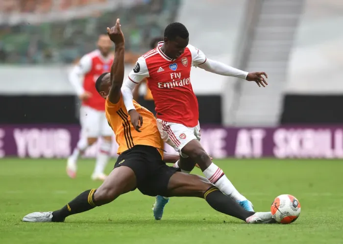 Framed Print : Nketiah vs. Boly: A Tense Battle in Wolverhampton Wanderers vs. Arsenal Premier League Clash (2019-20)
