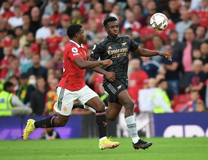 Framed Print : Nketiah vs Malacia: A Premier League Showdown - Arsenal vs Manchester United at Old Trafford (2022-23) Framed Print : Nketiah vs Malacia: A Premier League Showdown - Arsenal vs Manchester United at Old Trafford (2022-23)
