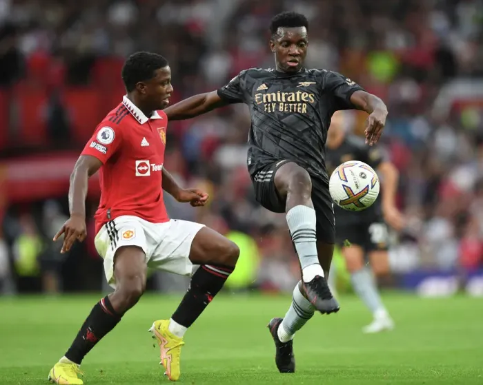 Framed Print : Nketiah vs Malacia: A Premier League Showdown at Old Trafford (2022-23)