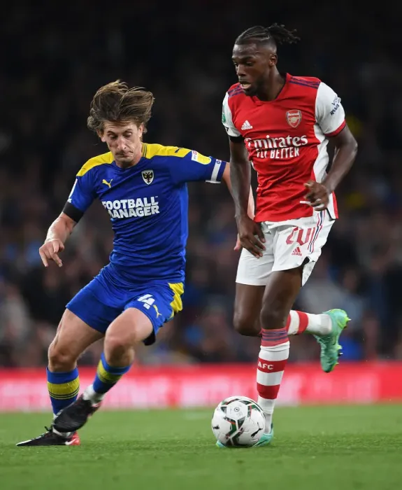 Framed Print : Nuno Tavares vs. Alex Woodyard: Arsenal's Defensive Battle in Carabao Cup Clash Against AFC Wimbledon