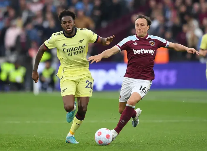 Framed Print : Nuno Tavares vs Mark Noble: Intense Battle in West Ham United vs Arsenal Premier League Clash Framed Print : Nuno Tavares vs Mark Noble: Intense Battle in West Ham United vs Arsenal Premier League Clash