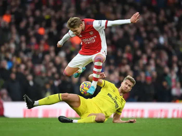 Framed Print : Odegaard vs. Ajer: A Premier League Battle at Arsenal Stadium