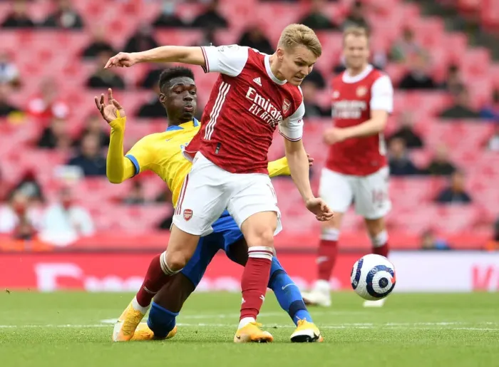 Framed Print : Odegaard vs Bissouma: A Premier League Showdown at Emirates Stadium (2020-21)