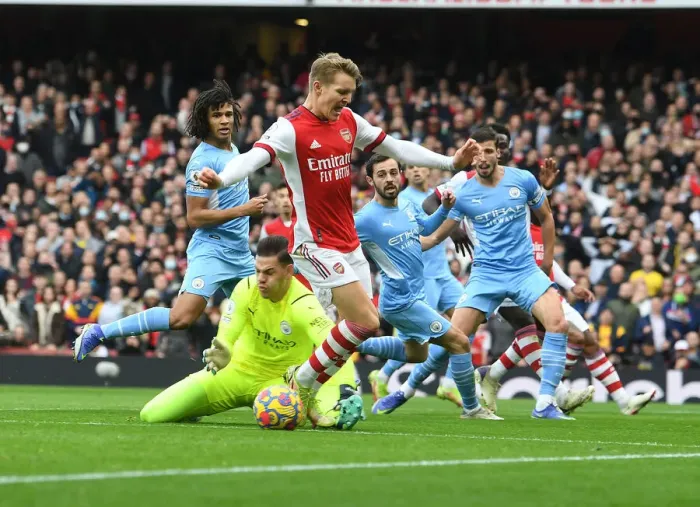 Framed Print : Odegaard vs Ederson: A Premier League Showdown at the Emirates