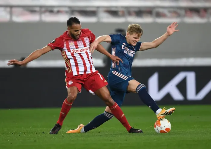 Framed Print : Odegaard vs El Arabi: A Battle in Empty Karaiskakis Stadium - Olympiacos vs Arsenal, UEFA Europa League Round of 16 Framed Print : Odegaard vs El Arabi: A Battle in Empty Karaiskakis Stadium - Olympiacos vs Arsenal, UEFA Europa League Round of 16