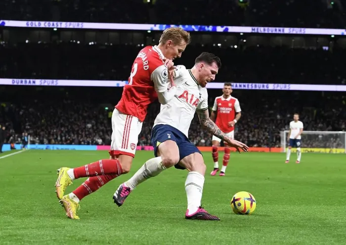 Framed Print : Odegaard vs. Hojbjerg: A Battle of Midfield Masters in the Premier League Showdown between Arsenal and Tottenham