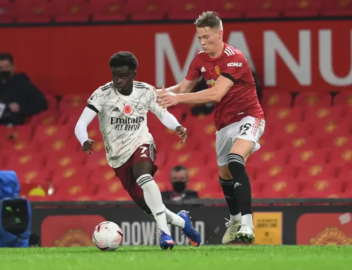 Framed Print : Empty Old Trafford Showdown: Bukayo Saka vs Scott McTominay, Manchester United vs Arsenal, Premier League 2020-21