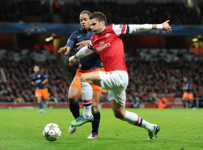 Framed Print : Olivier Giroud (Arsenal) Daniel Congre (Montpellier). Arsenal 2: 0 Montpellier. UEFA Framed Print : Olivier Giroud (Arsenal) Daniel Congre (Montpellier). Arsenal 2: 0 Montpellier. UEFA
