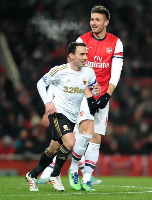 Framed Print : Olivier Giroud (Arsenal) Leon Britton (Swansea). Arsenal 1: 0 Swansea City. FA Cup 3rd Round replay
